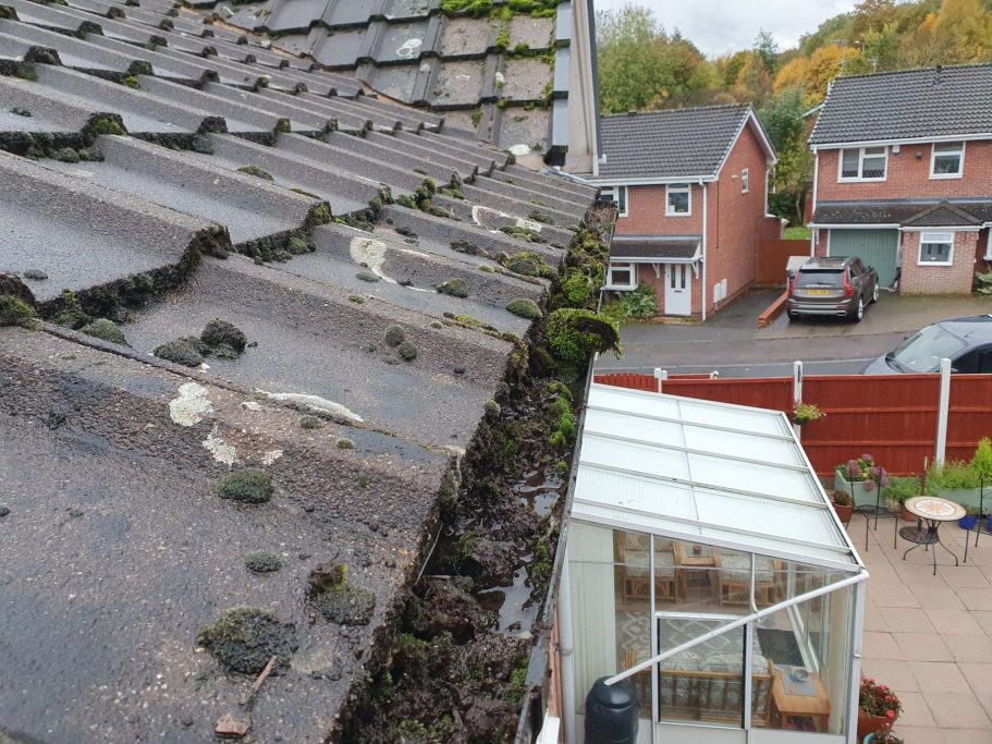 guttering on house full of debris